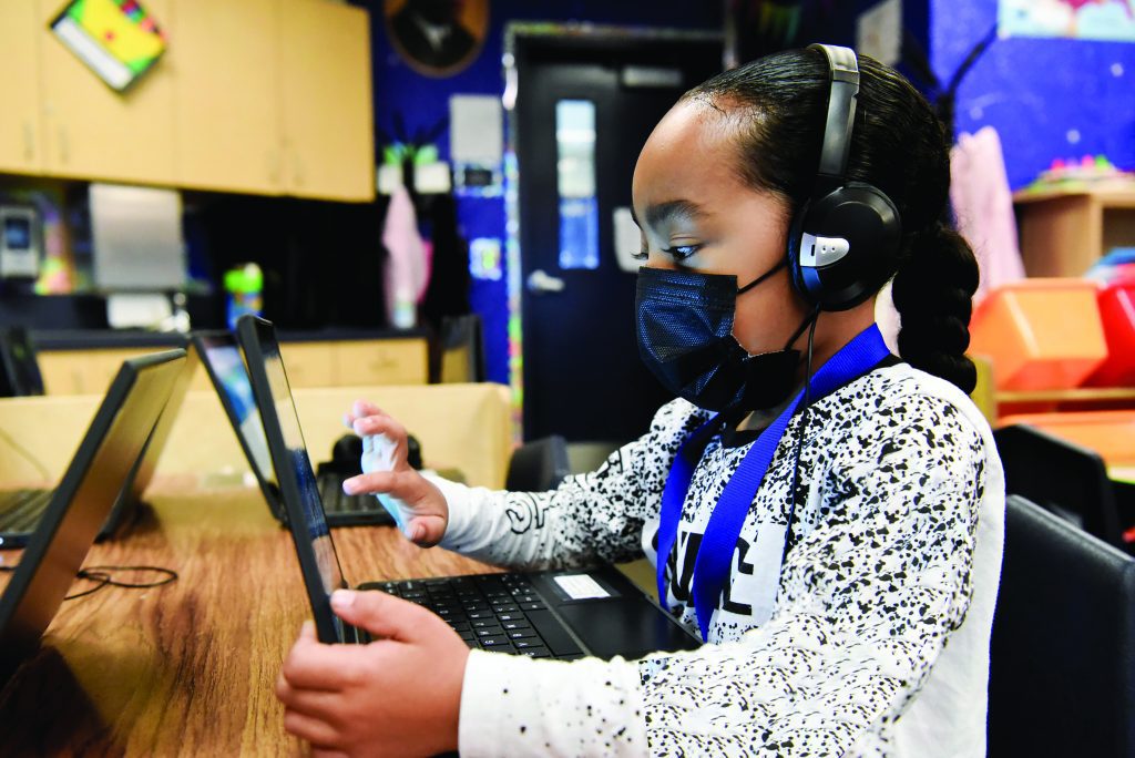 Elementary student using a laptop