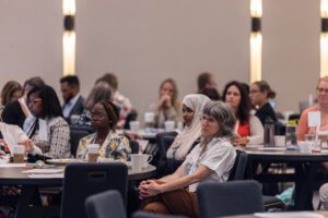 Network members listen at tables during the StriveTogether Policy Summit