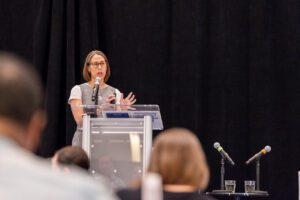 A speaker presents at the podium at the StriveTogether policy summit