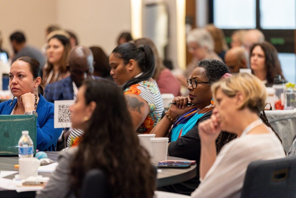 Audience members listen to a speaker at the StriveTogether policy summit