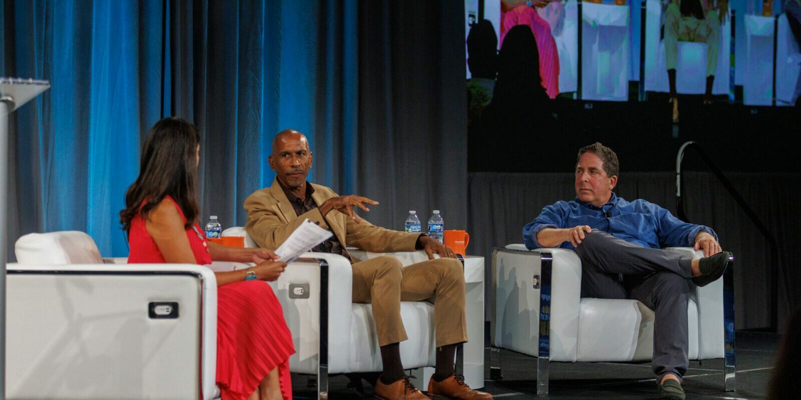 Marcia Quinones, Pedro Noguera and Rick Hess join in conversation, seated on a stage