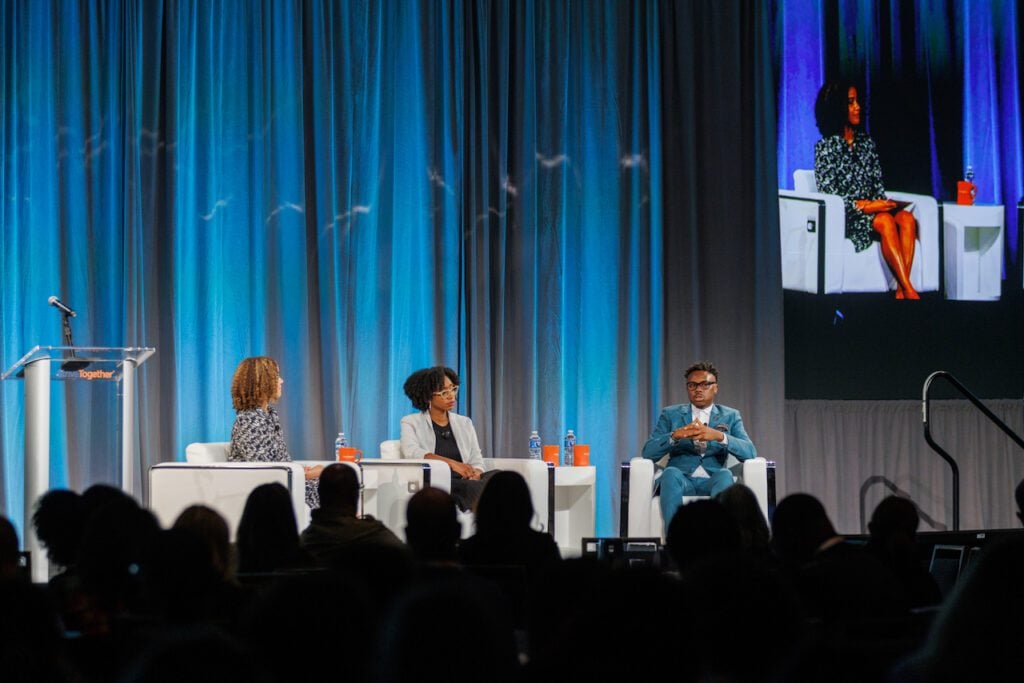 Jerelyn Rodriguez, co-founder and CEO of The Knowledge House, and Dr. Tim Lampkin, CEO of Higher Purpose Co., speak at the 2023 Cradle to Career Network Convening