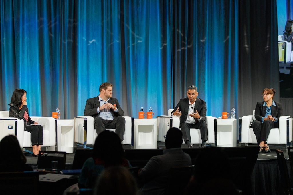 Daisy Nguyen, Colin Groth, Richard Raya and Kim Johnson sit on stage at the 2023 Cradle to Career Network Convening