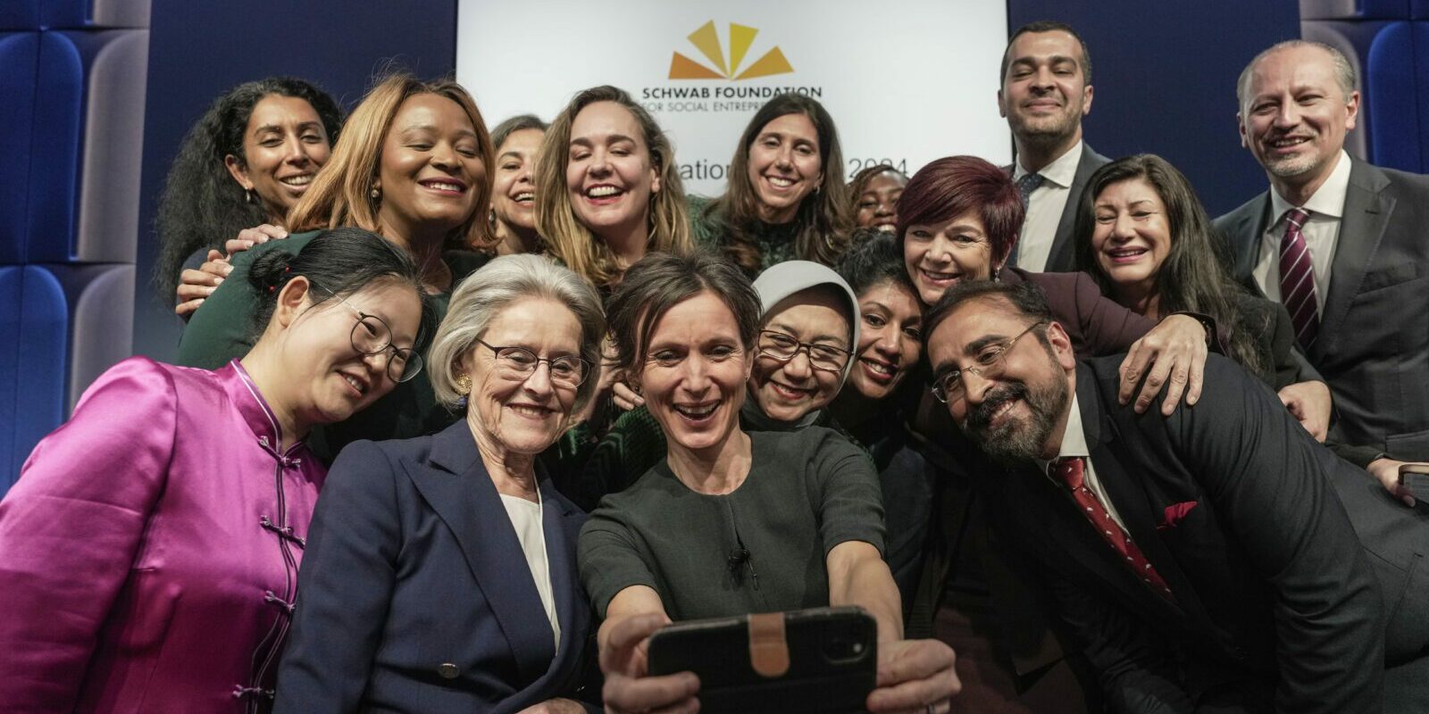 The recipients of the Schwab Foundation 2024 Social Innovation Awards pose for a selfie